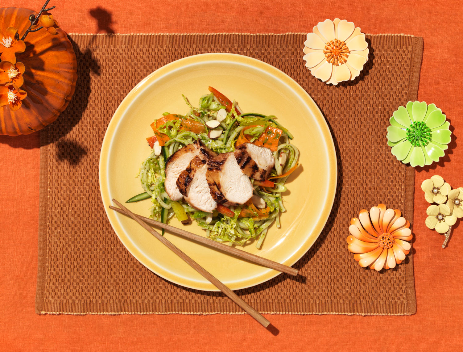 grilled chicken and shredded cabbage on orange placemat