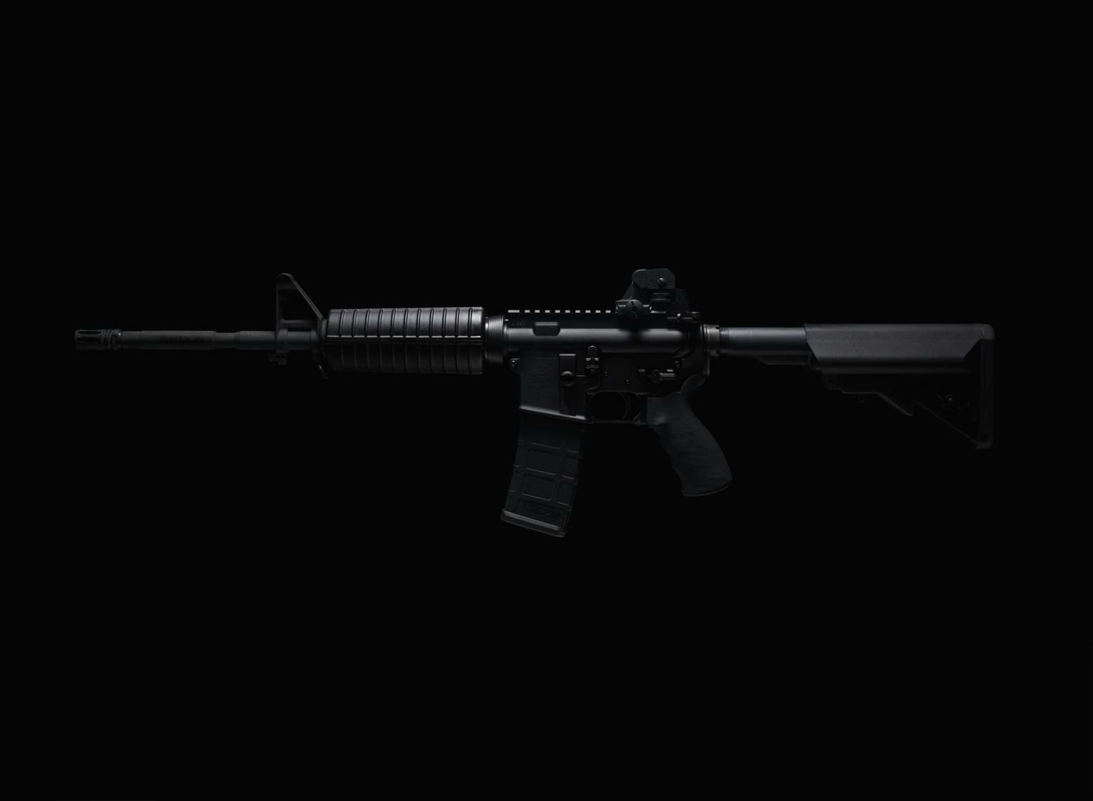 dark photo of an AR-15 rifle