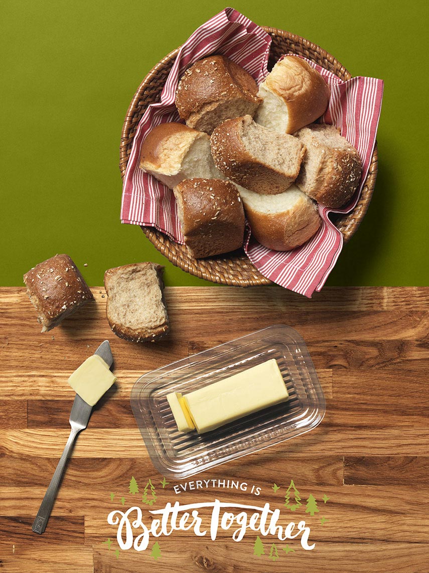 basket of bread with a butter dish