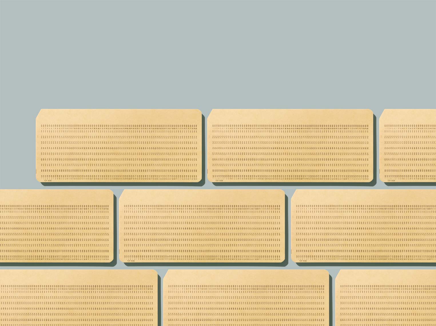 punched cards in a pattern on green