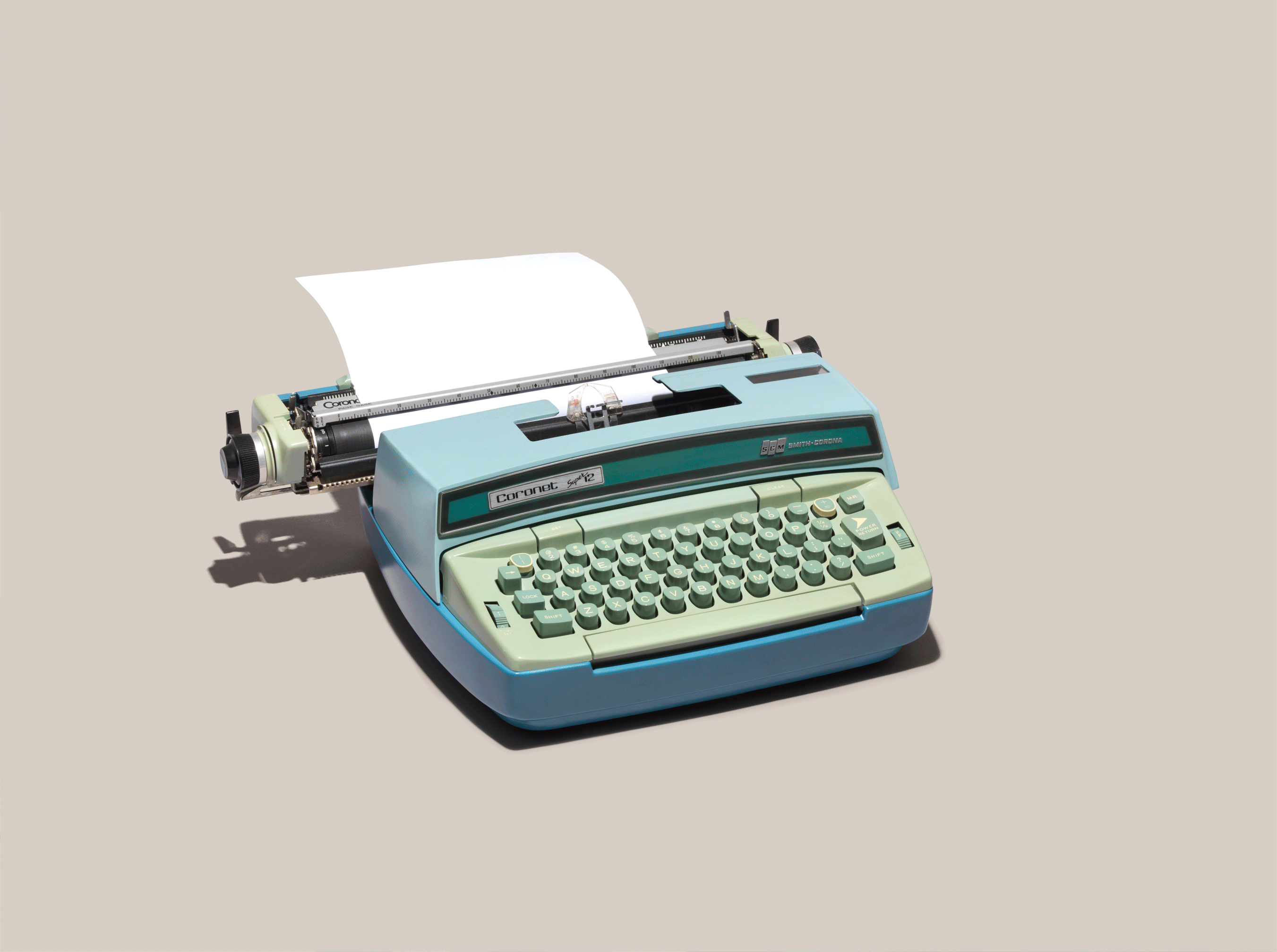 vintage analog typewriter on a green background