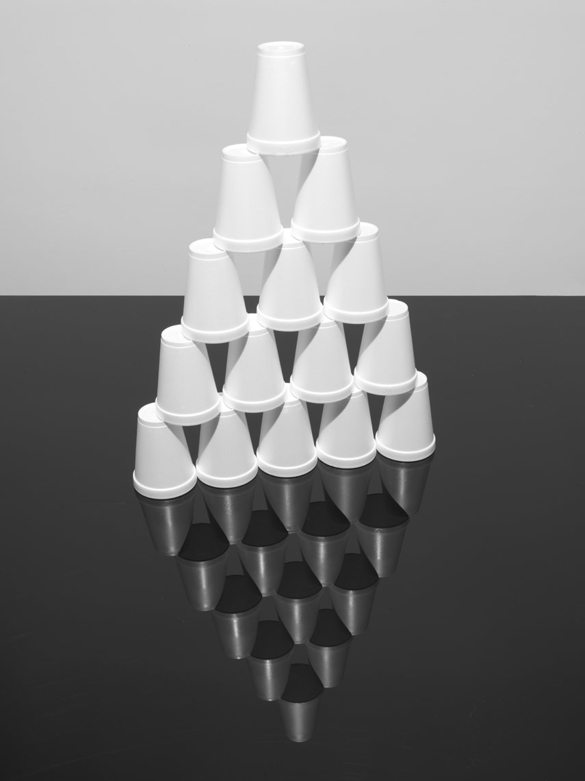simple stack of styrofoam cups on black plexiglass