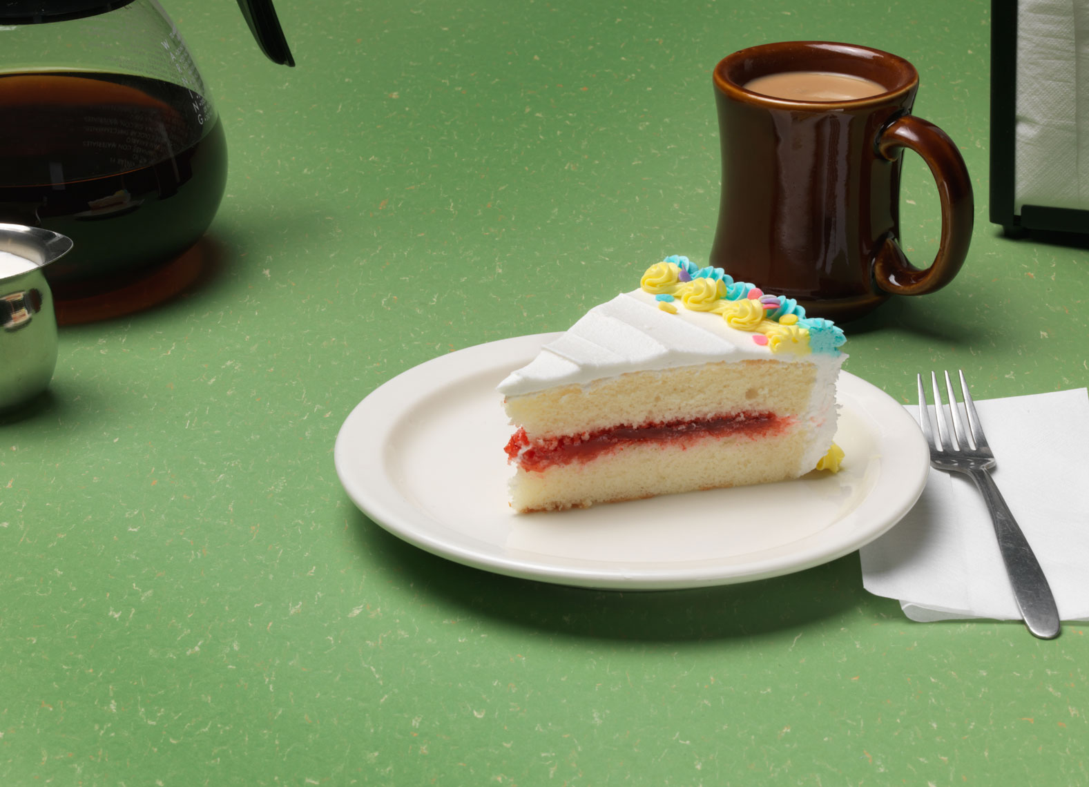 slice of white cake at a diner