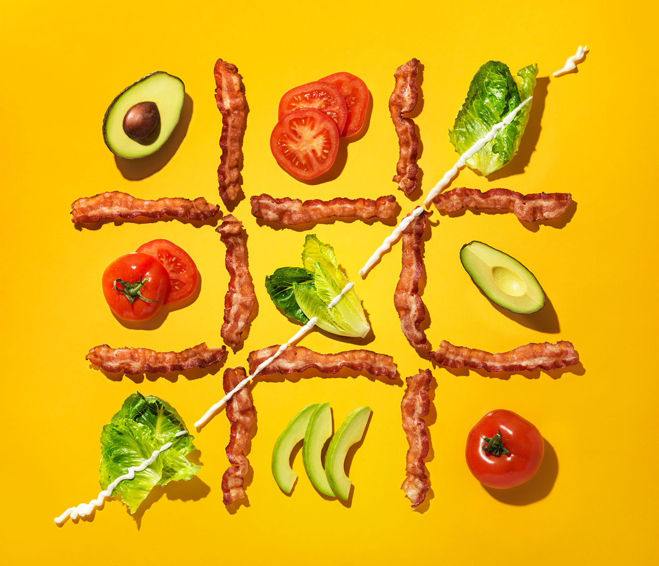 bacon lettuce tomato tic tac toe on yellow 