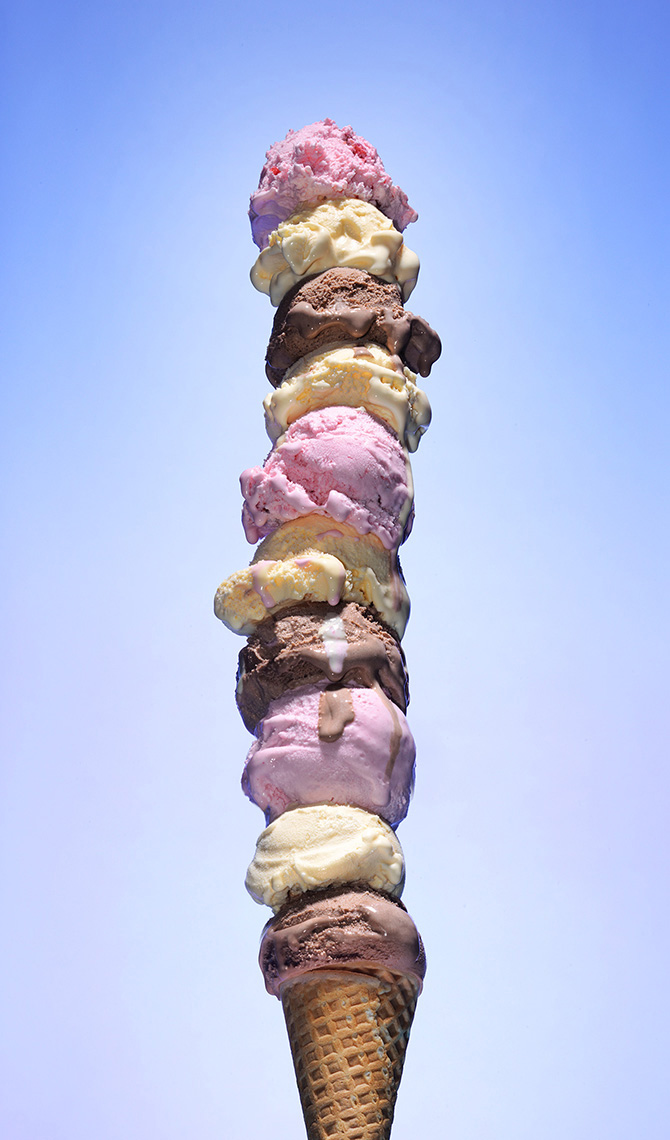 very tall ice cream cone  ten scoops