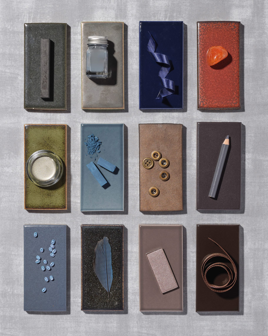 small objects arranged on a dark tile collection for ann sacks tiles